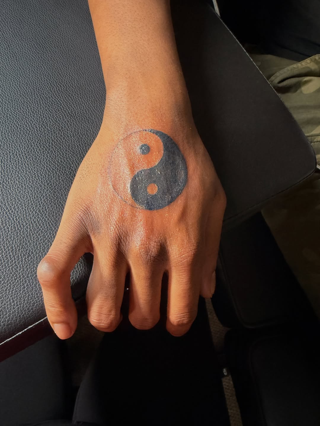Yin yang symbol tattoo on the hand by @bloodline__legacy