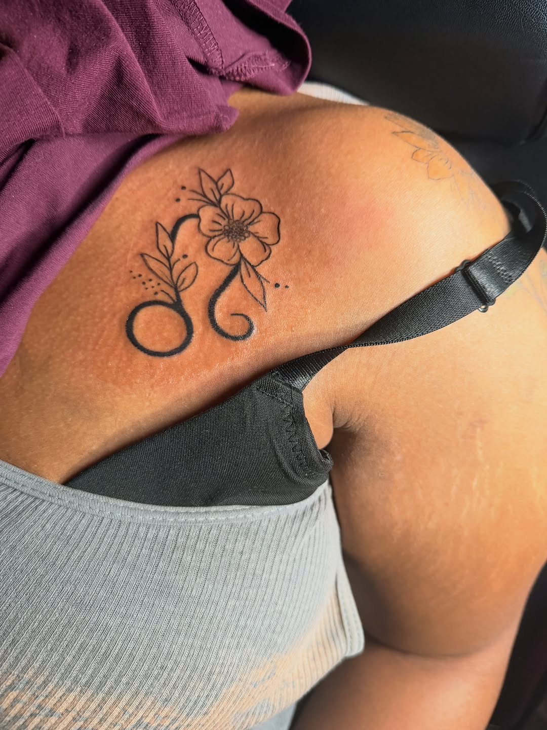 Flower and zodiac sign tattoo on the thigh by @bloodline__legacy