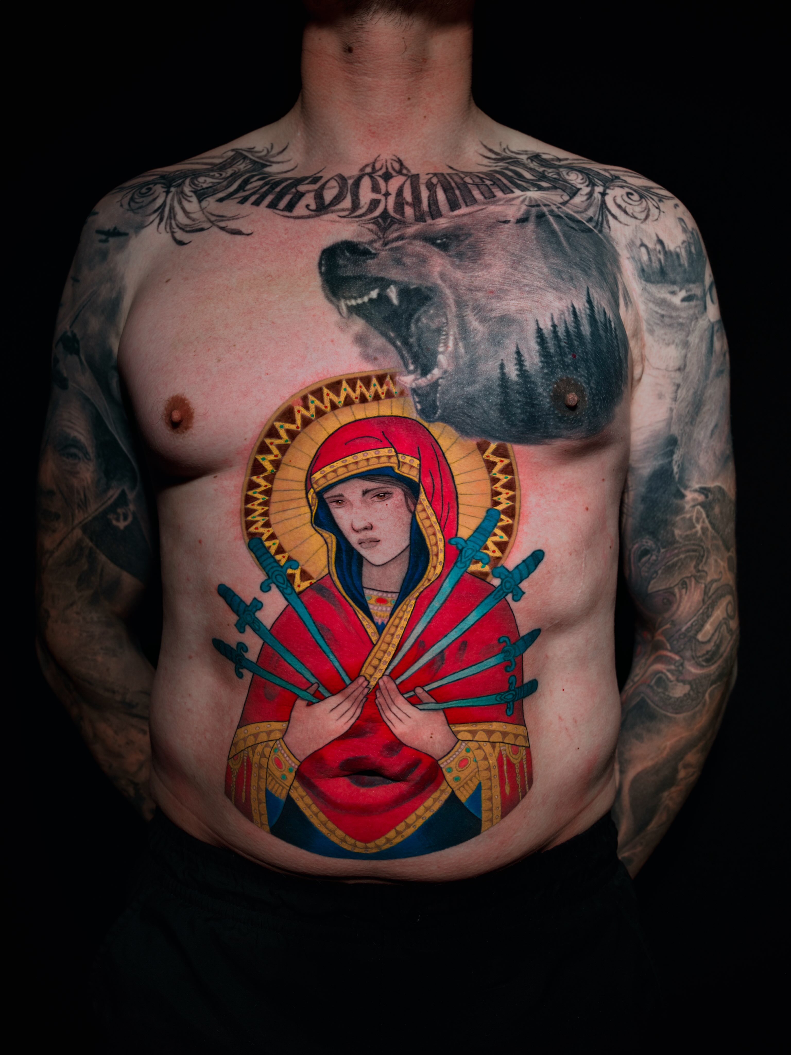 Religious figure with swords American traditional tattoo on the chest by Igor Puente