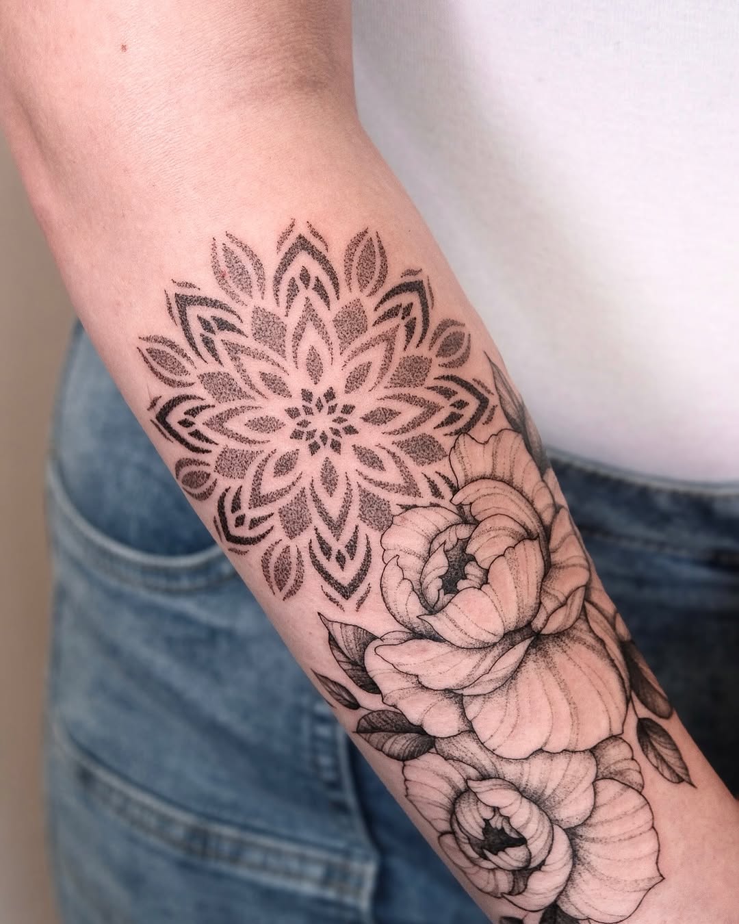 Mandala and peonies dotwork tattoo on the forearm by Your tattoo Artist, New York, New York