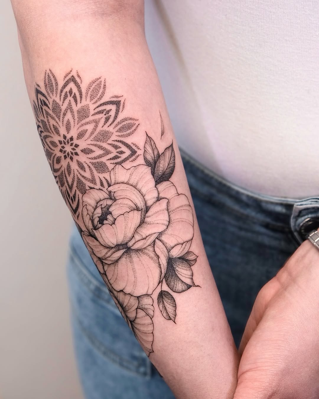Mandala and peony flowers dotwork tattoo on the forearm by Your tattoo Artist, New York, New York