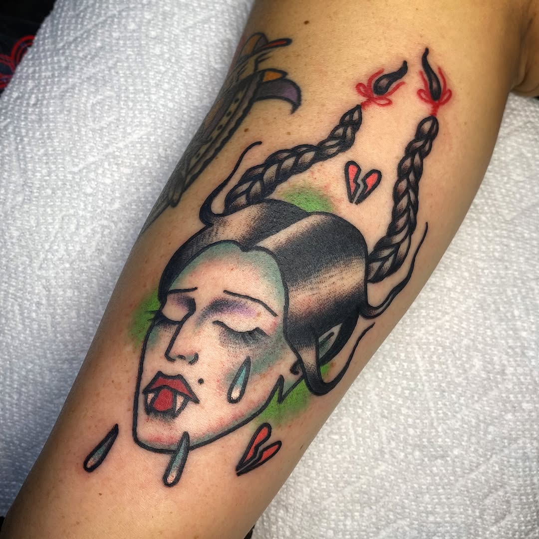 Crying vampire face with braids neo-traditional tattoo on the forearm by ππππππππ