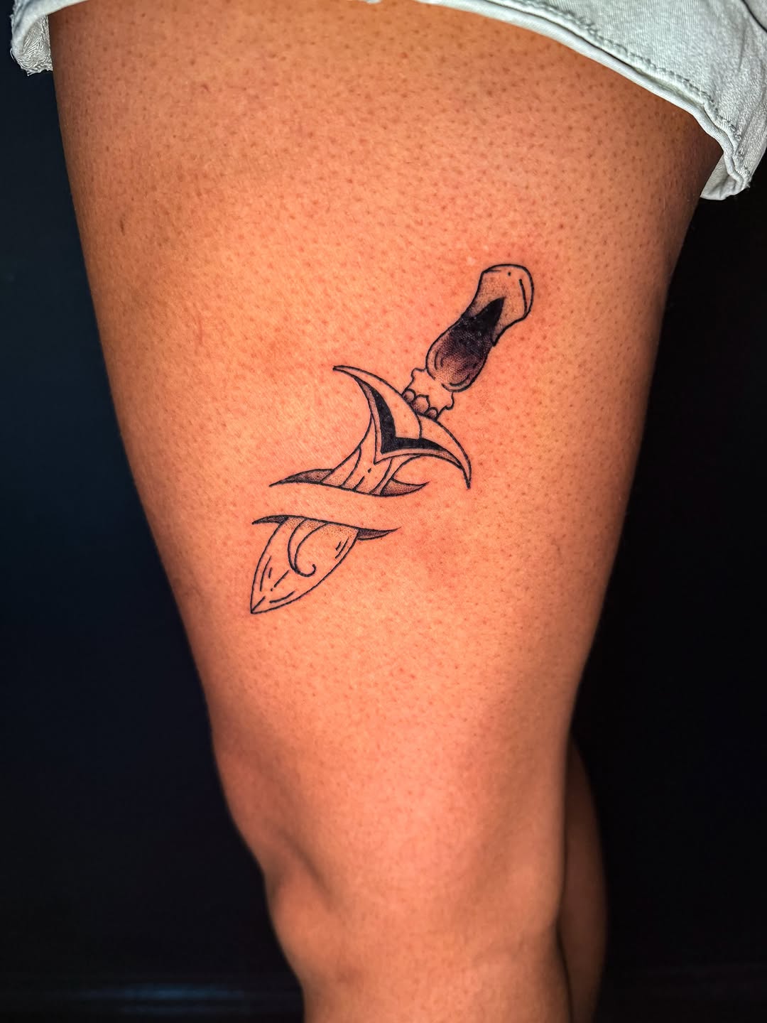 Dagger with abstract elements American traditional tattoo on the thigh by Ivy-Jade Edwards, Memphis, Tennessee