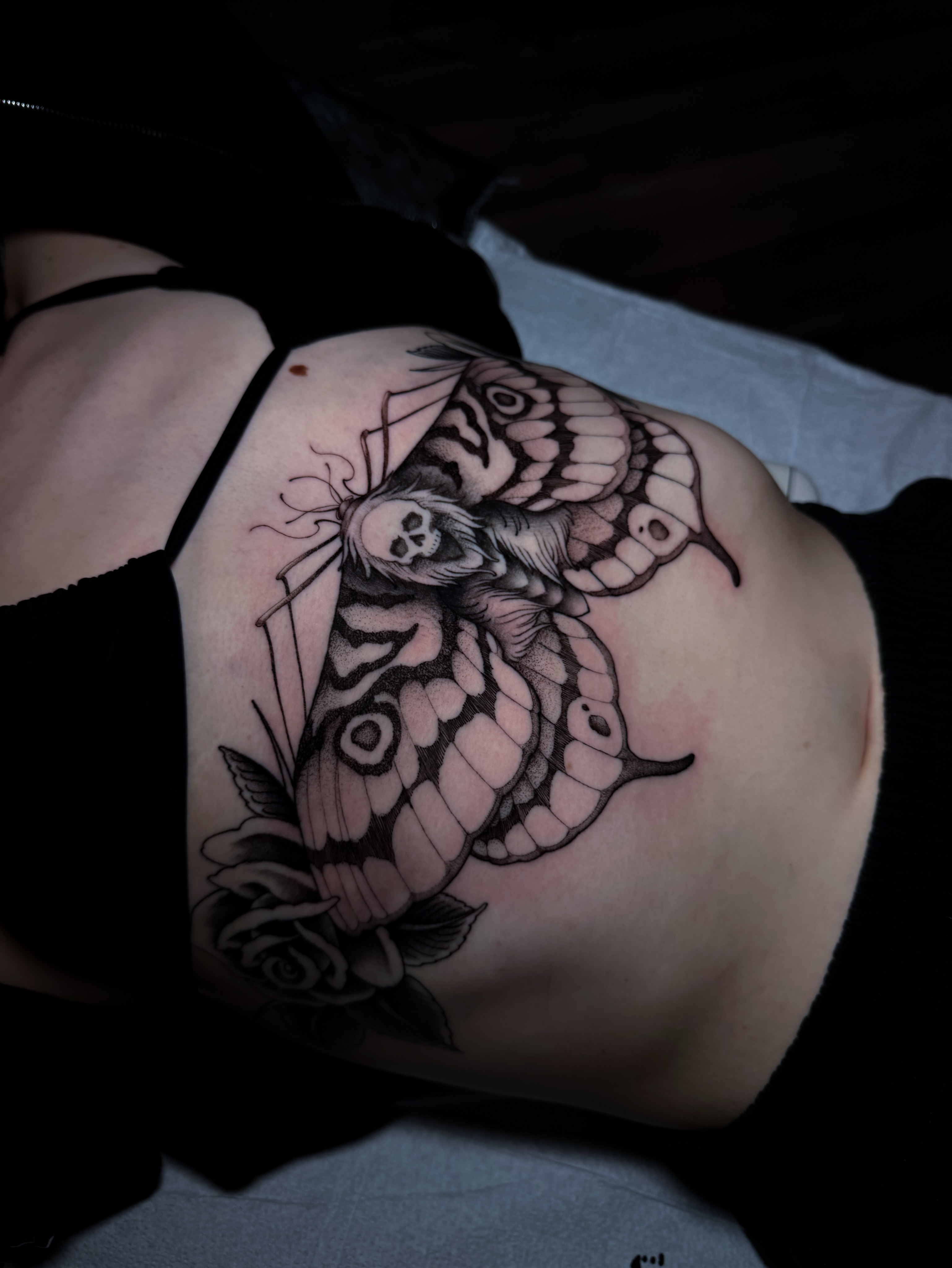 Butterfly and skull realism tattoo by Carrie