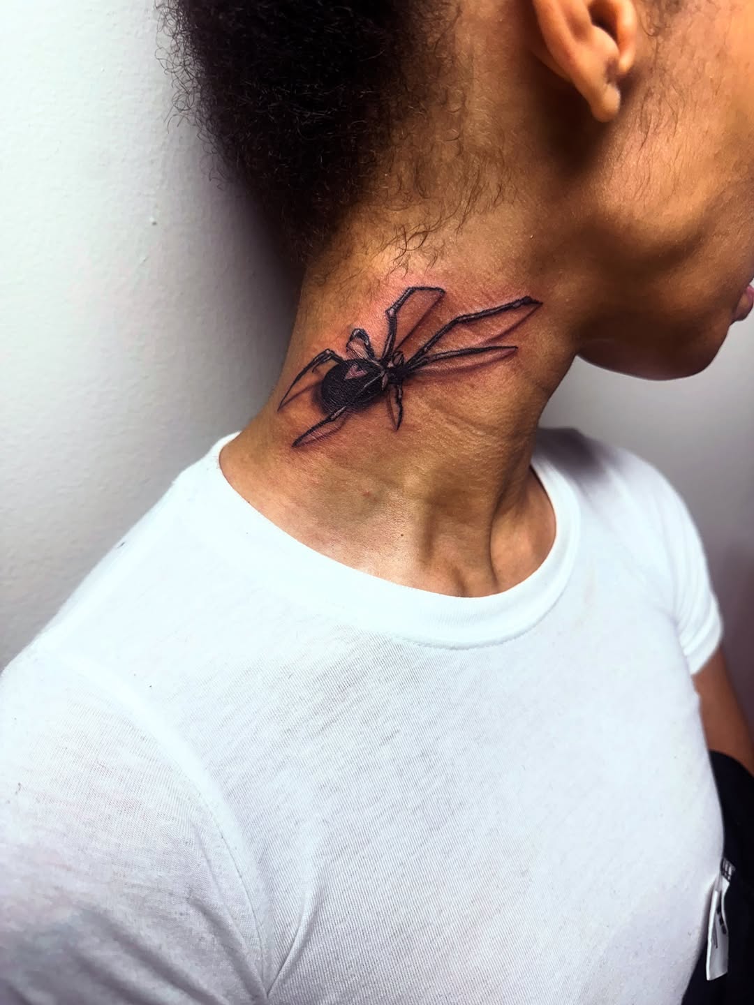 Black widow spider cyber sigilism tattoo on the neck by Uncle Fade Tattoo Artist ✍🏾