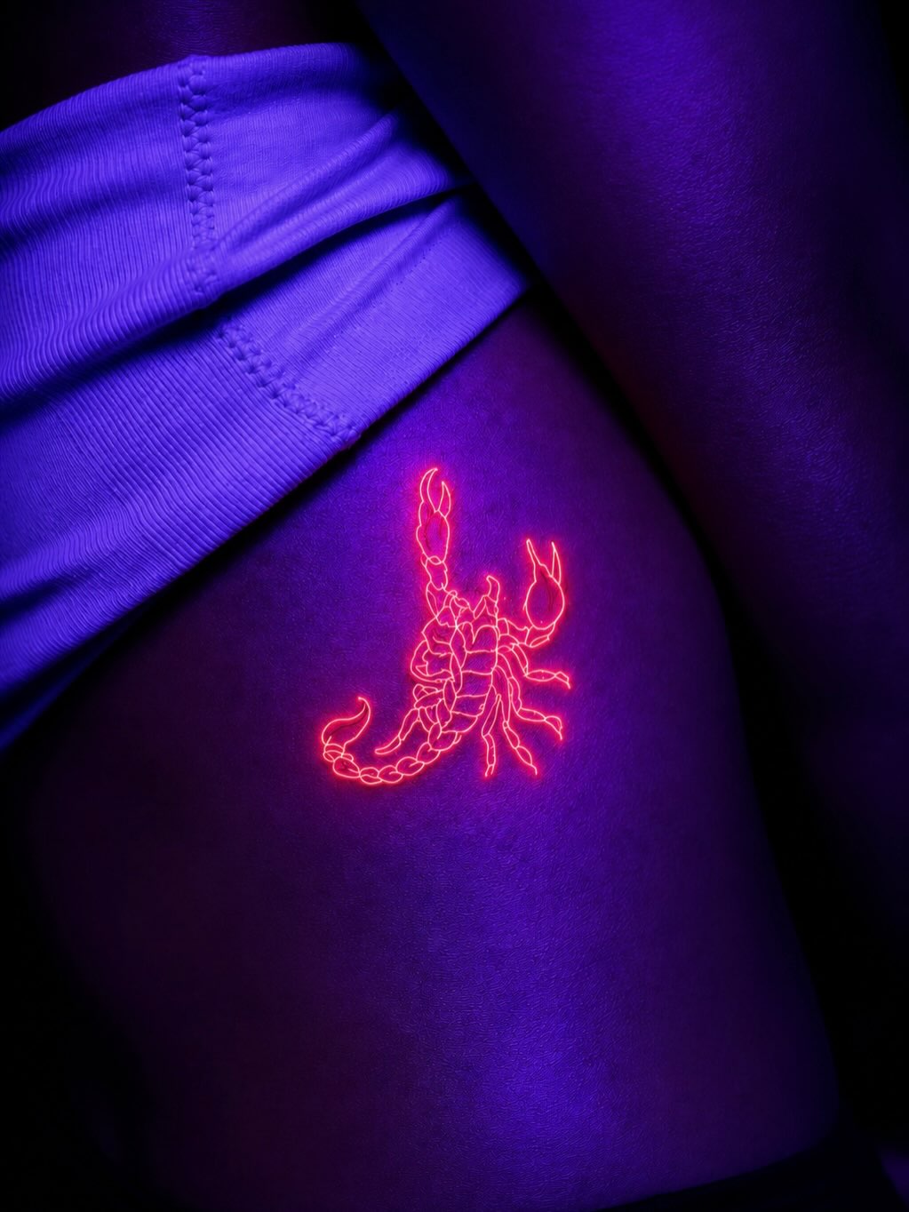 Glowing scorpion fine line tattoo on the thigh by Montero Ink™