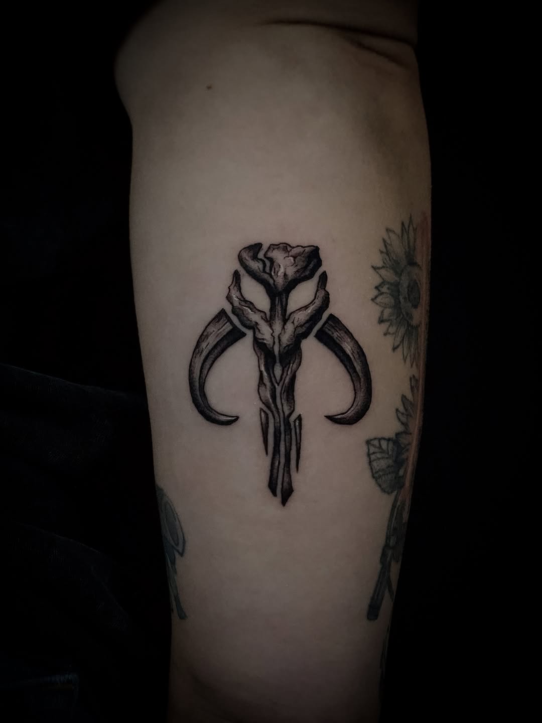 Mandalorian skull symbol cyber sigilism tattoo on the forearm by Kanya, Alhambra, California