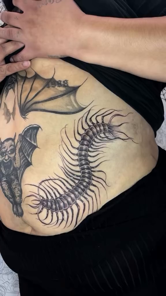 Skeleton centipede and bat cyber sigilism tattoo on the hand by Weho Tattoo Artist Lupe