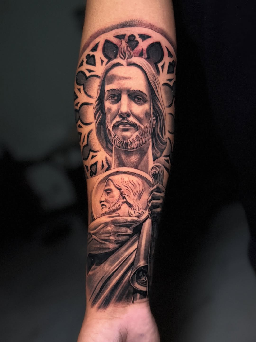 Jesus portrait with religious imagery Chicano tattoo on the forearm by Flames, Cerritos, California