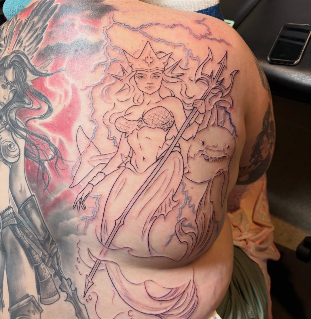 Mermaid illustrative tattoo on the back by Adriana Wimler