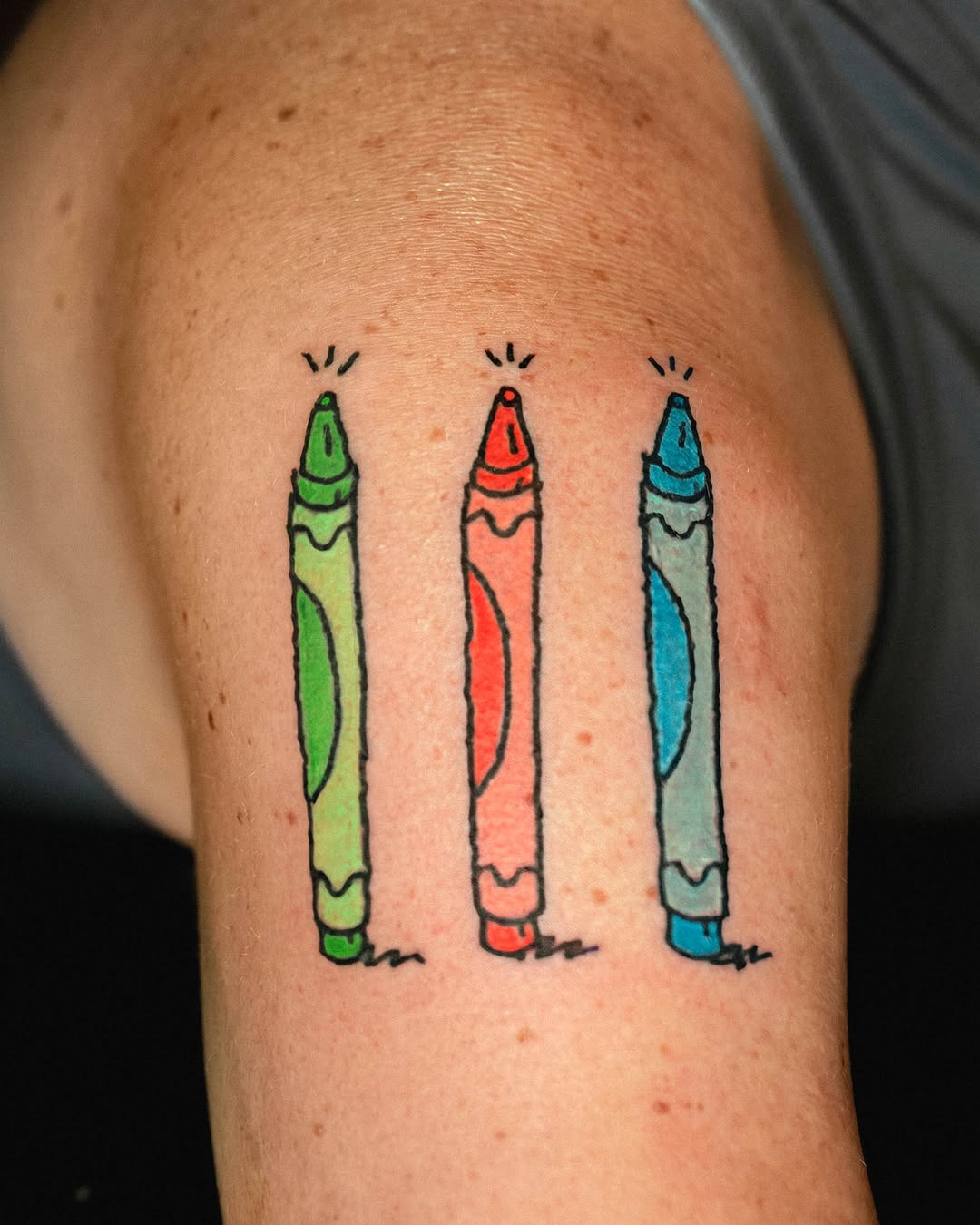 Three crayons American traditional tattoo on the shoulder by Flash Boom Bang Tattoo