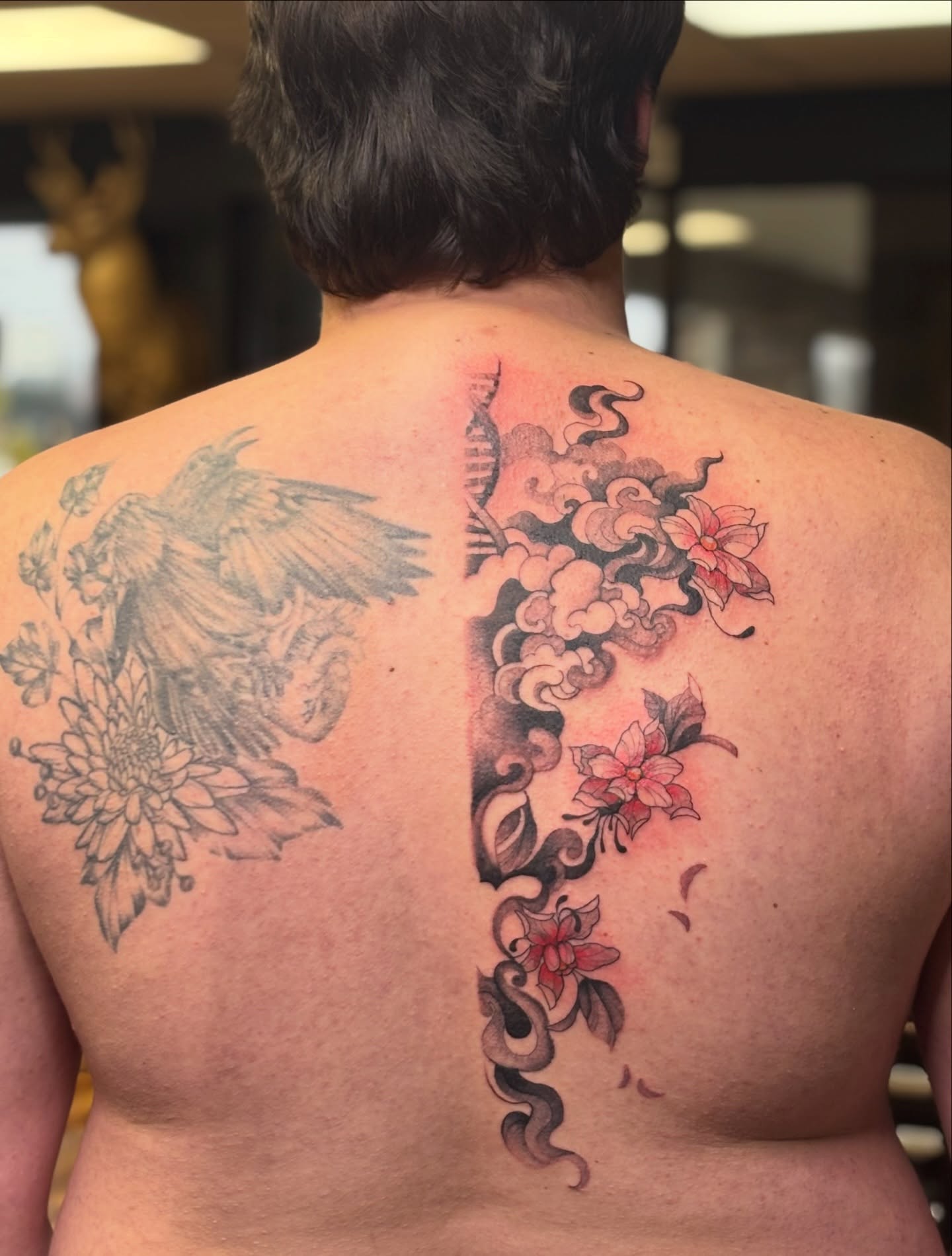 Floral and bird japanese irezumi tattoo on the back by MJ Saunders