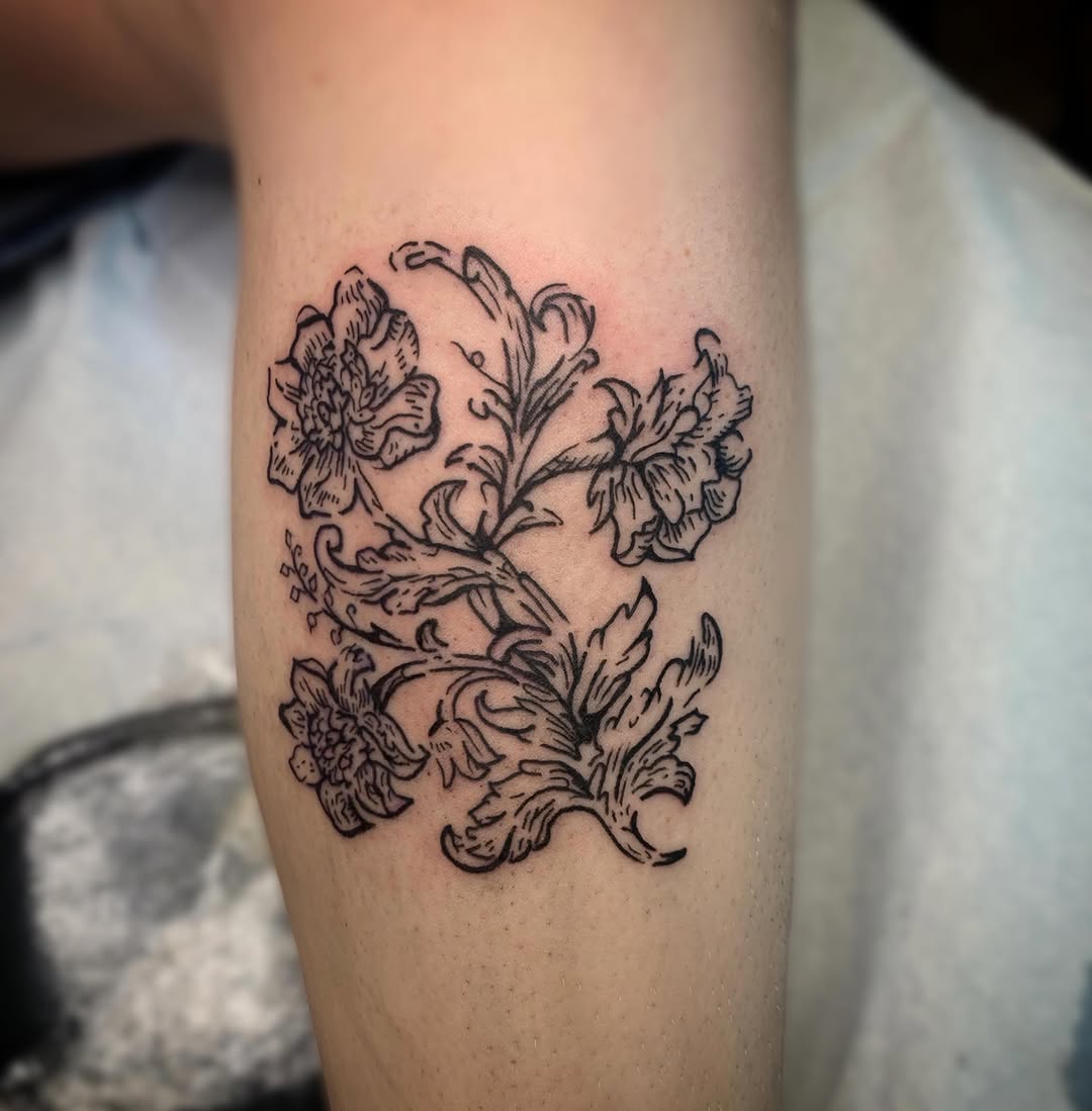 Floral vine fine line tattoo on the forearm by Ava Glory Tattoos
