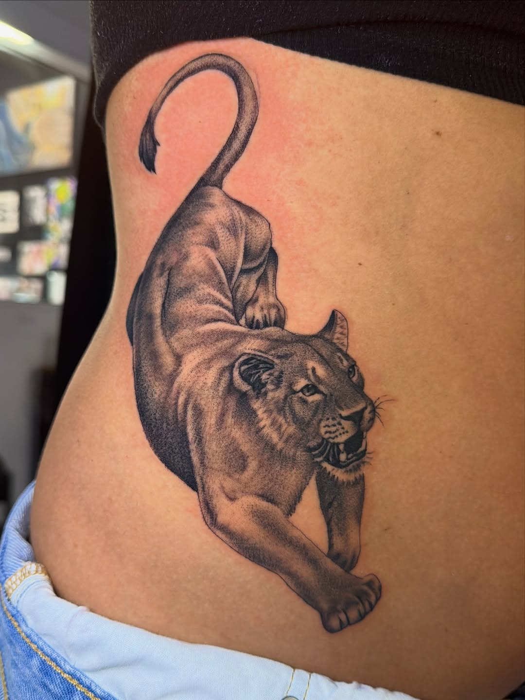 Lioness realism tattoo on the ribs by Eduardo Chaparro