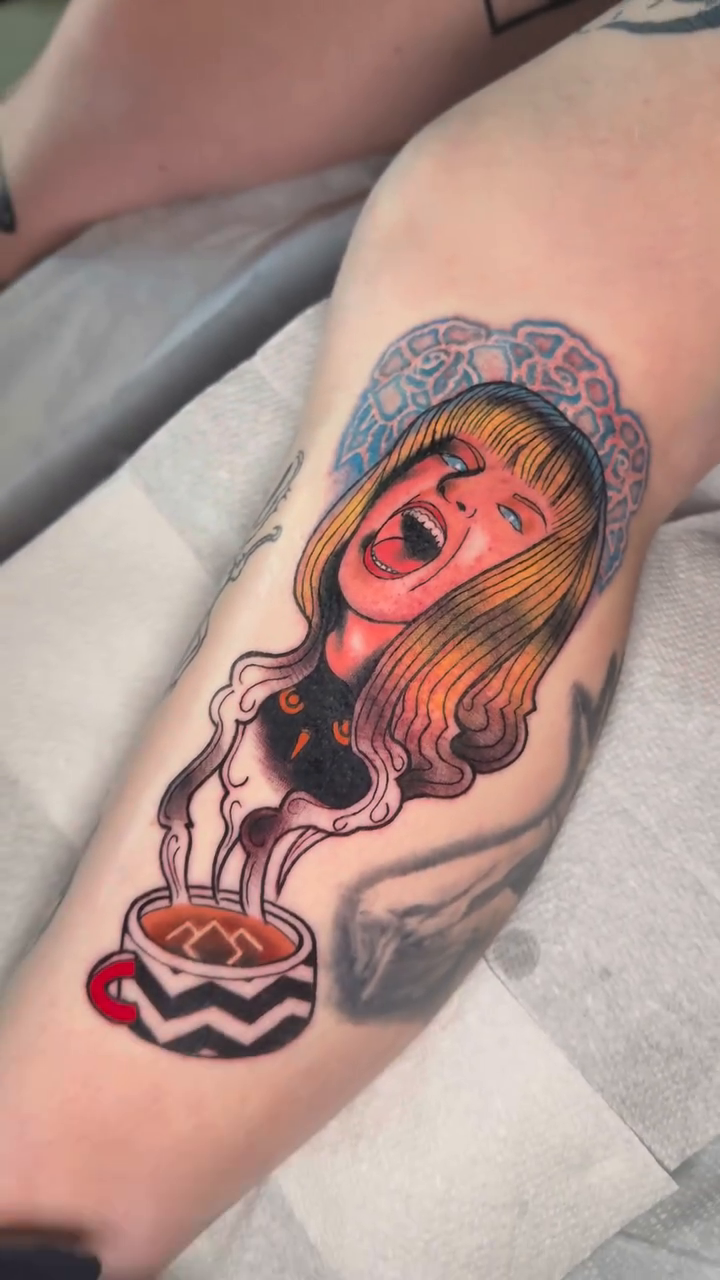 Screaming woman emerging from coffee cup neo-traditional tattoo on the forearm by Mercy Dean