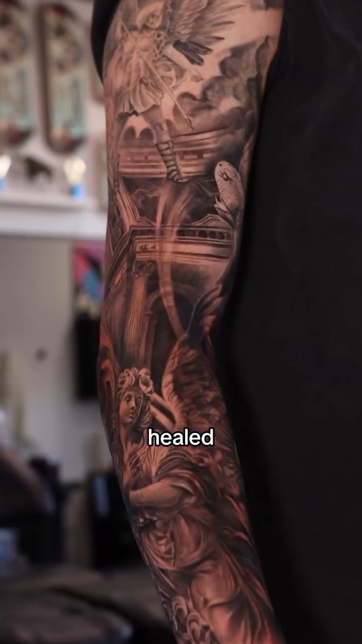Angelic figures in a dramatic scene realism tattoo on the forearm by Naomi Burke, New Westminster, British Columbia