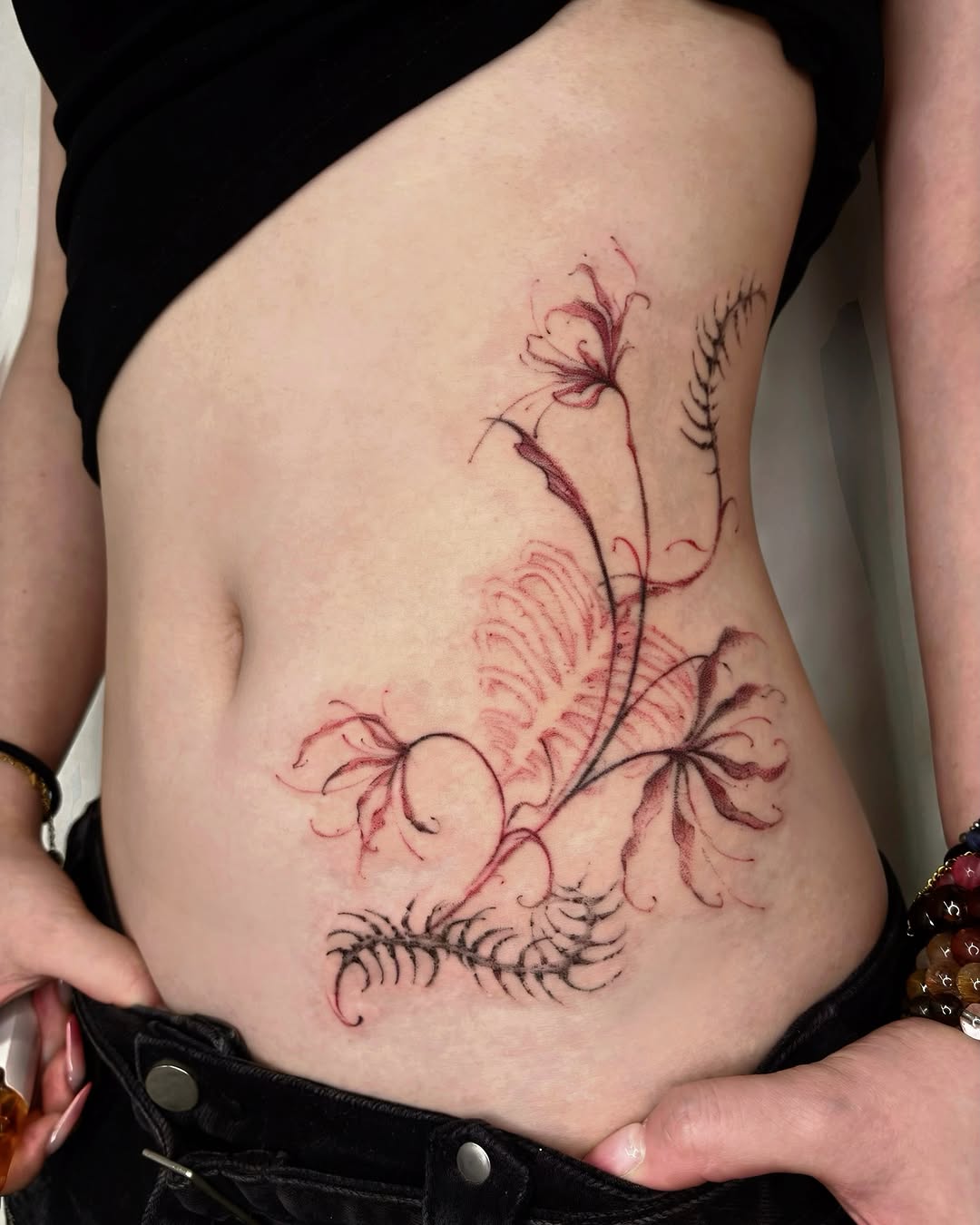 Floral design black and grey tattoo on the ribs by @havefun_tattoo