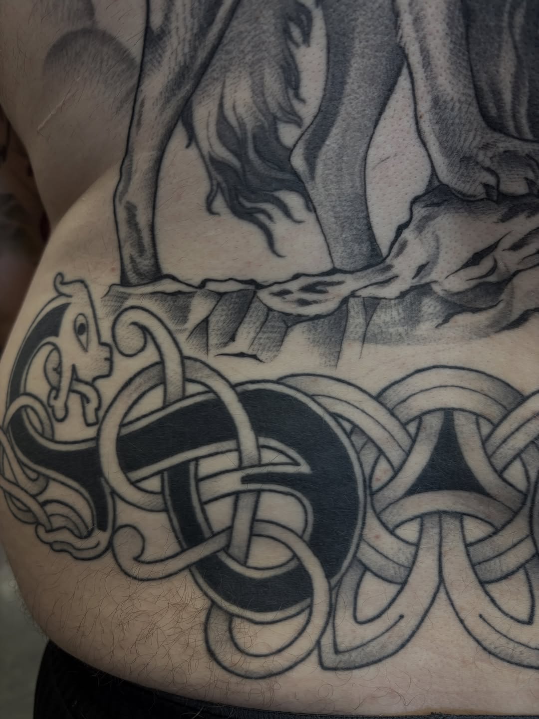 Celtic knotwork and animal tribal tattoo on the torso by Amelia Rose, Los Angeles, California