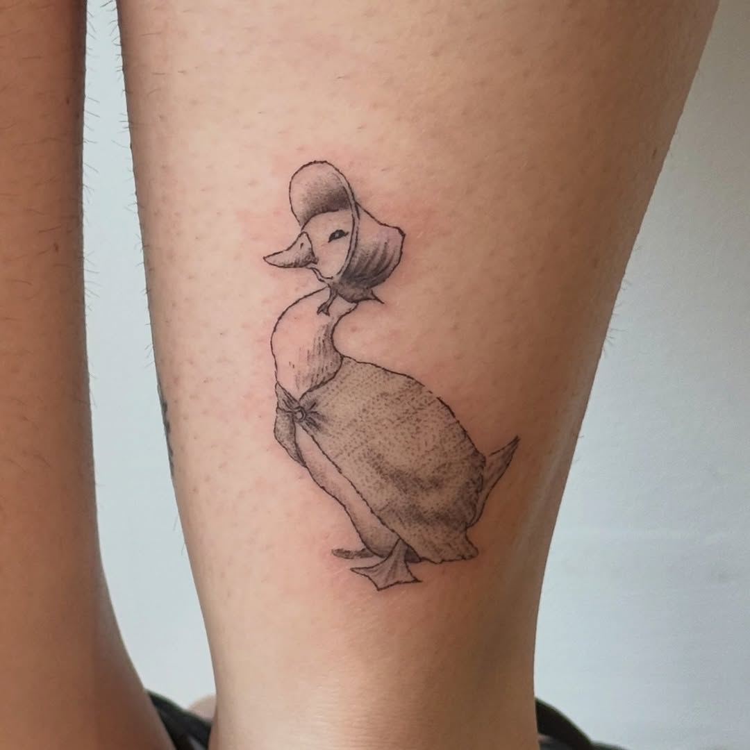 Duck in bonnet fine line tattoo on the forearm by Kirsten