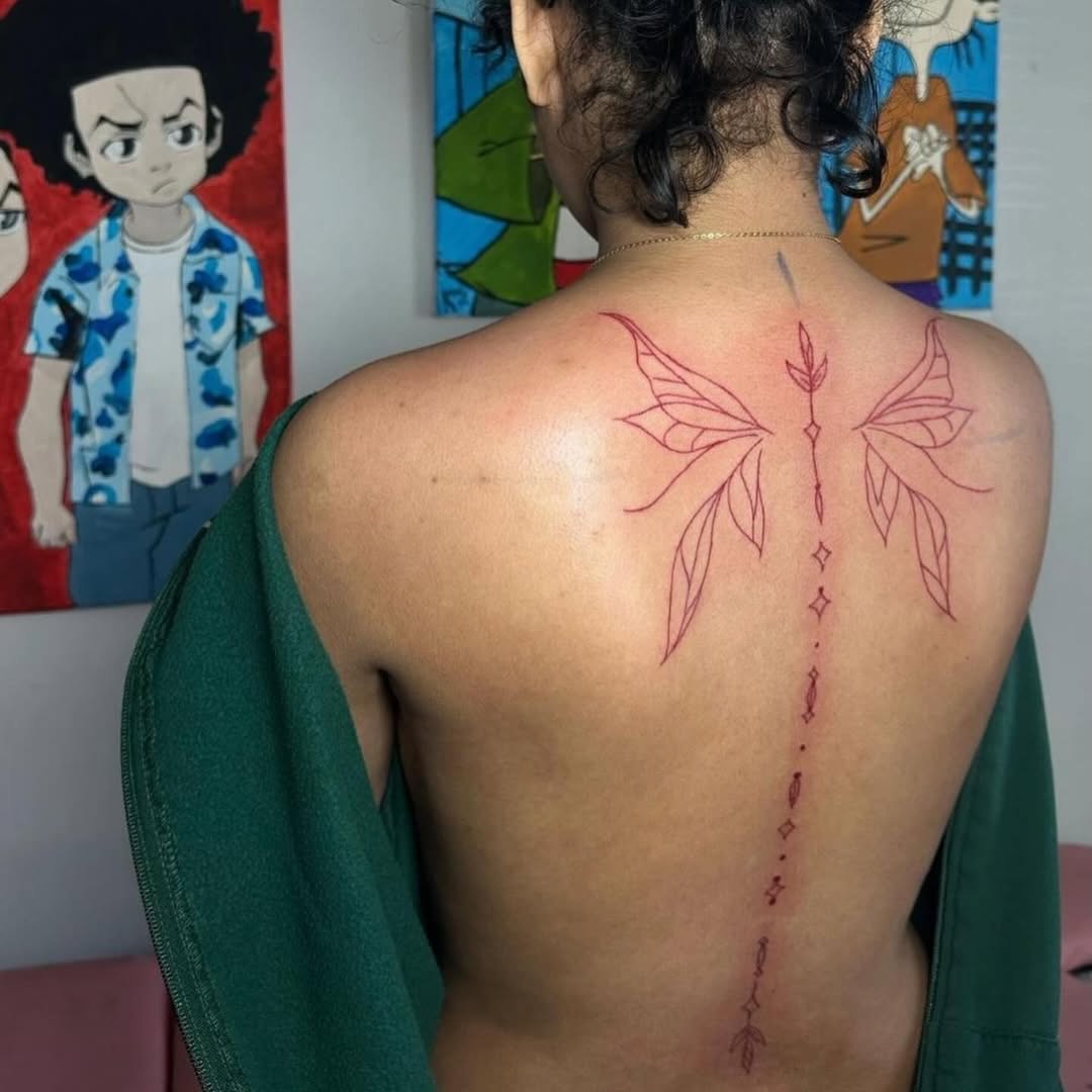 Butterfly wings and floral elements blackwork tattoo on the back by Inkby_larry