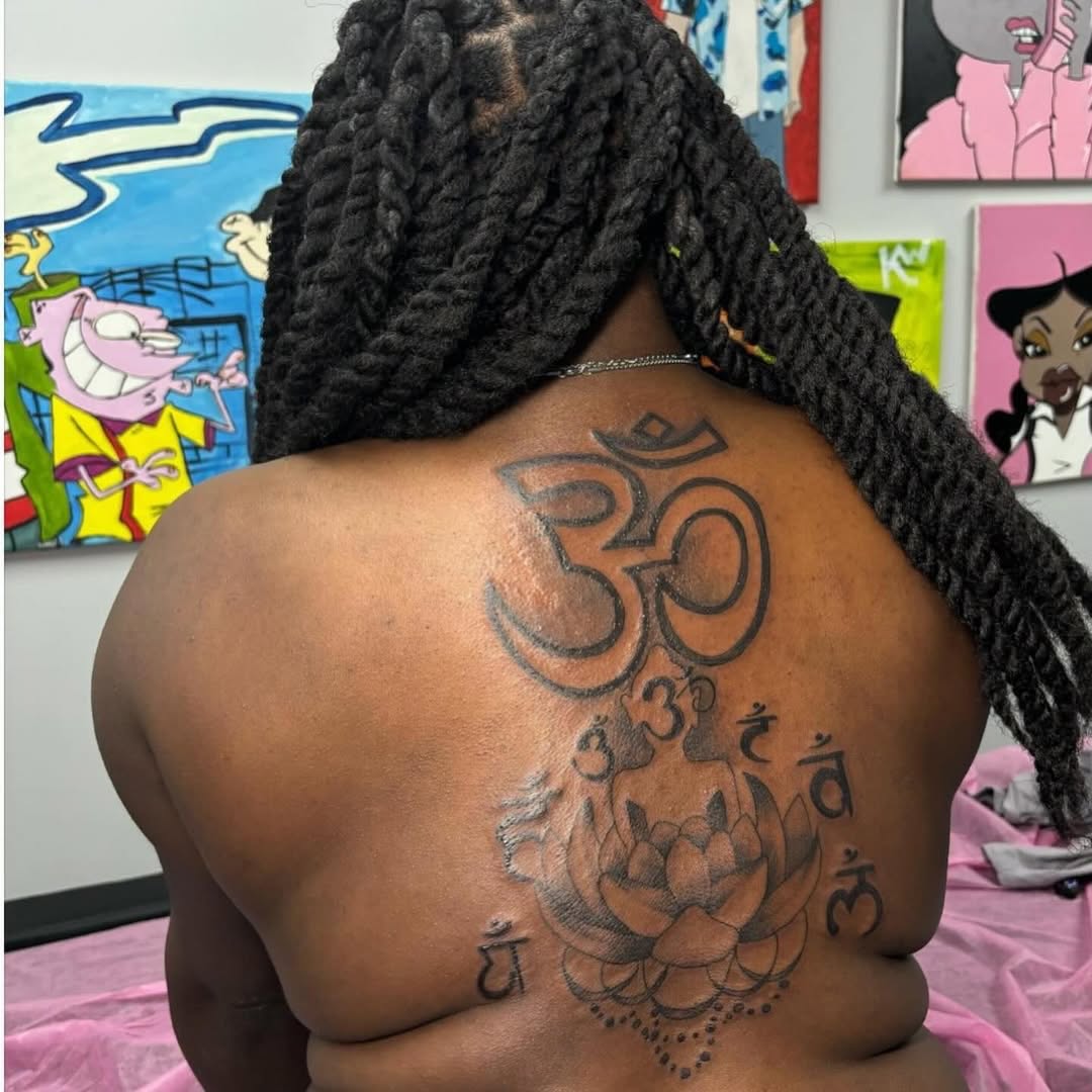 Om symbol with Buddha and lotus ornamental tattoo on the back by Inkby_larry
