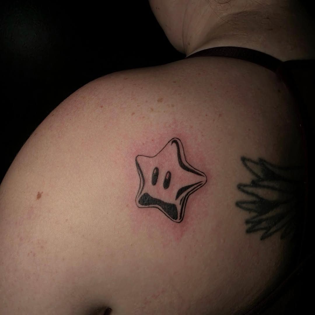 Super Mario star new school tattoo on the shoulder by Scar