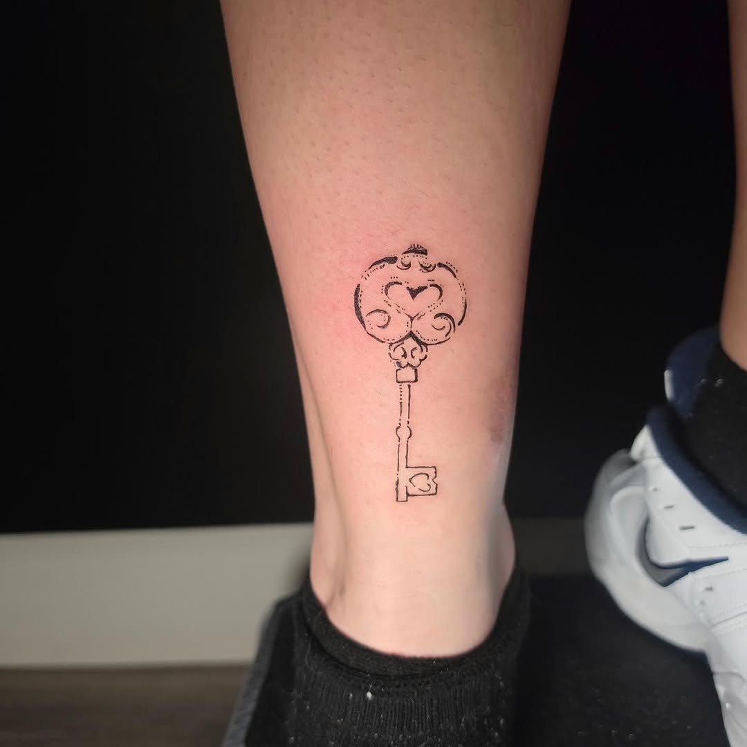 Ornate key ornamental tattoo on the calf by Scar
