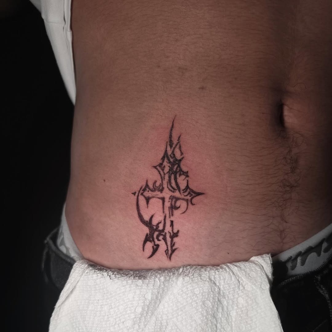 Ornamental cross blackwork tattoo on the torso by Scar