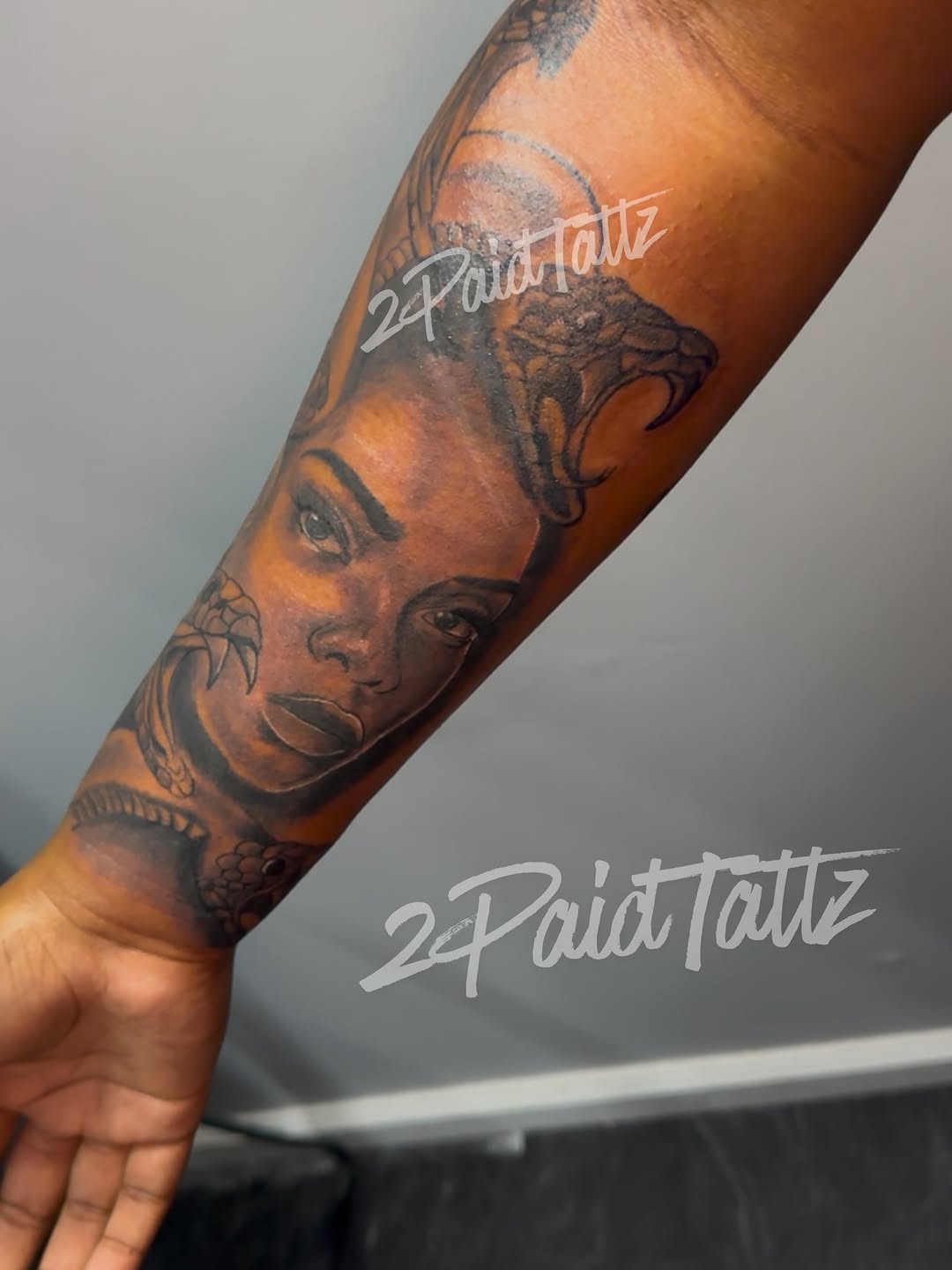Medusa portrait with snake realism tattoo on the forearm by 2PaidTattz