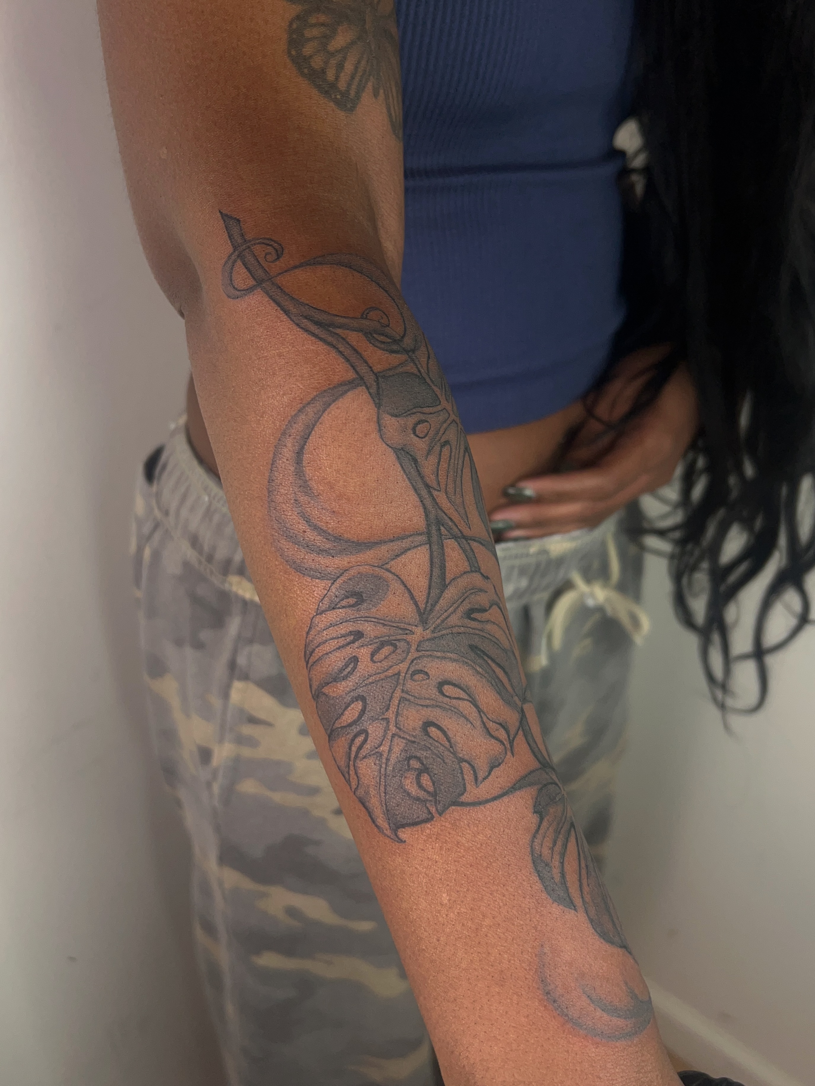 Monstera leaf and snake geometric tattoo on the forearm by ༻𝐓𝐡𝐞 𝐒𝐤𝐢𝐧 𝐆𝐚𝐫𝐝𝐞𝐧༺