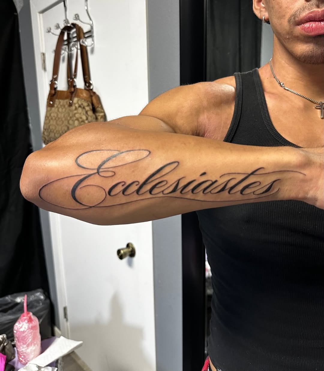 Ecclesiastes lettering lettering tattoo on the forearm by Lupita Ink
