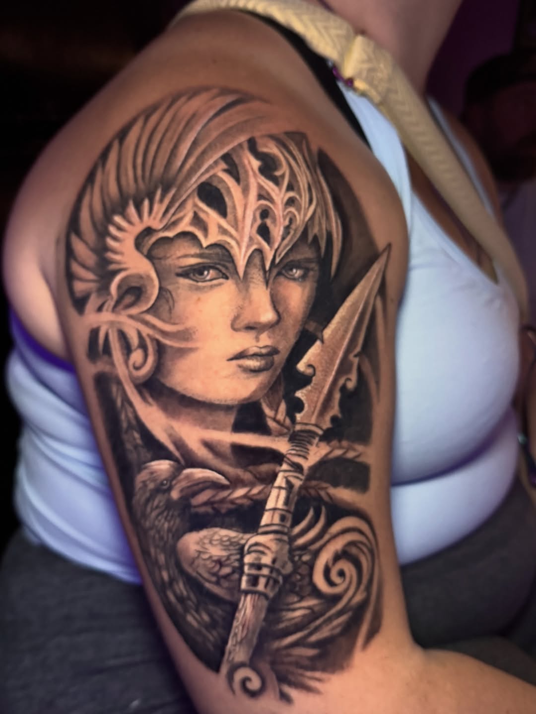 Woman warrior with raven and spear realism tattoo on the shoulder by Jarrod Gatzke