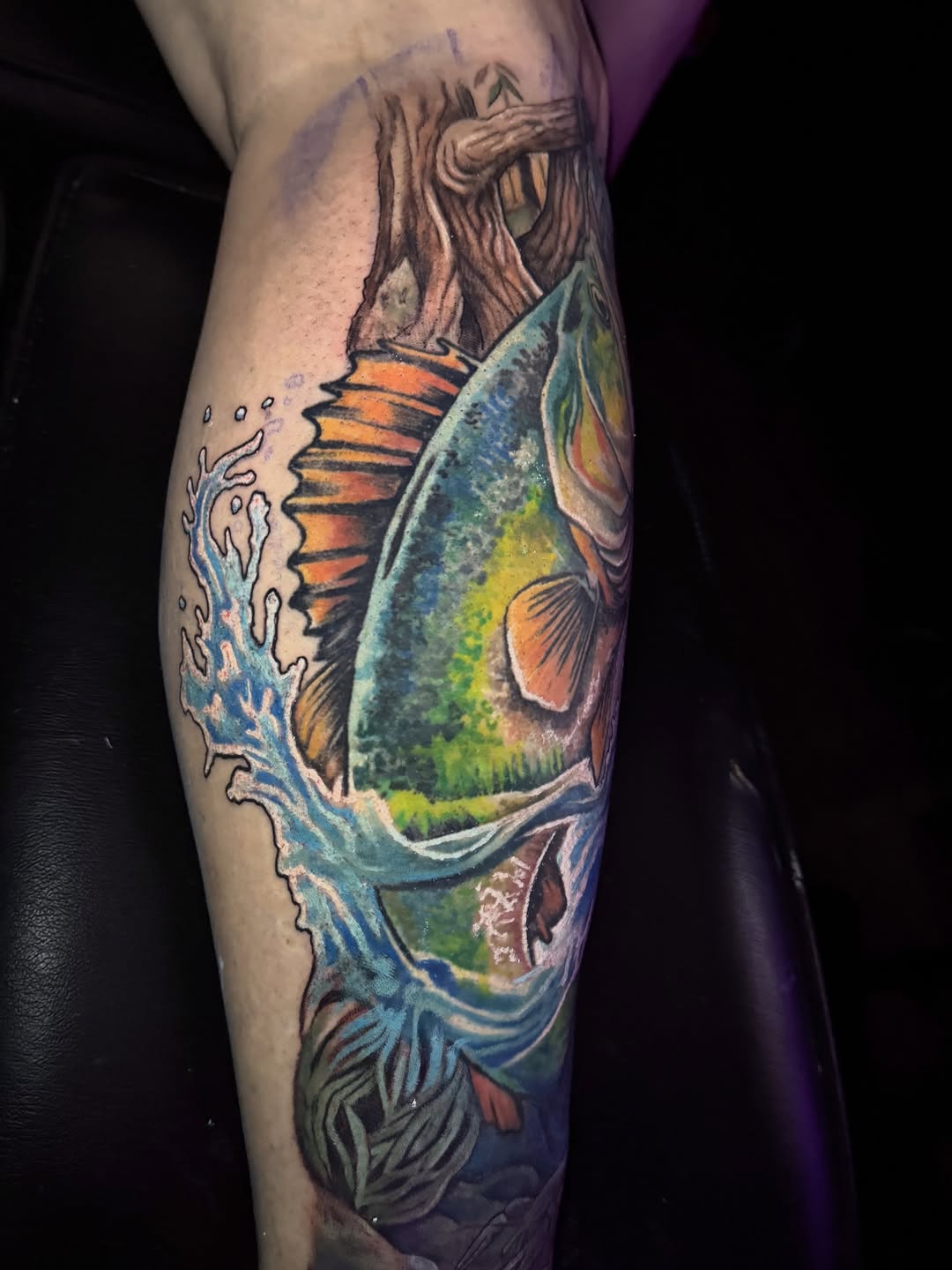 Fish and tree in water American traditional tattoo on the forearm by Jarrod Gatzke