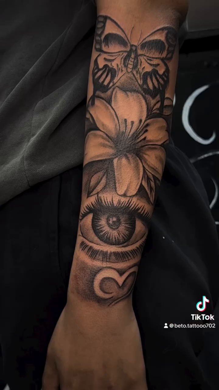 Sleeve with text and imagery surrealism tattoo on the upper arm by Betotats