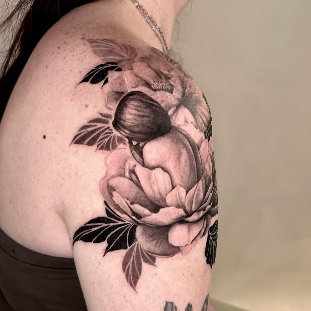 Woman in flower sketch tattoo on the shoulder by Longtea