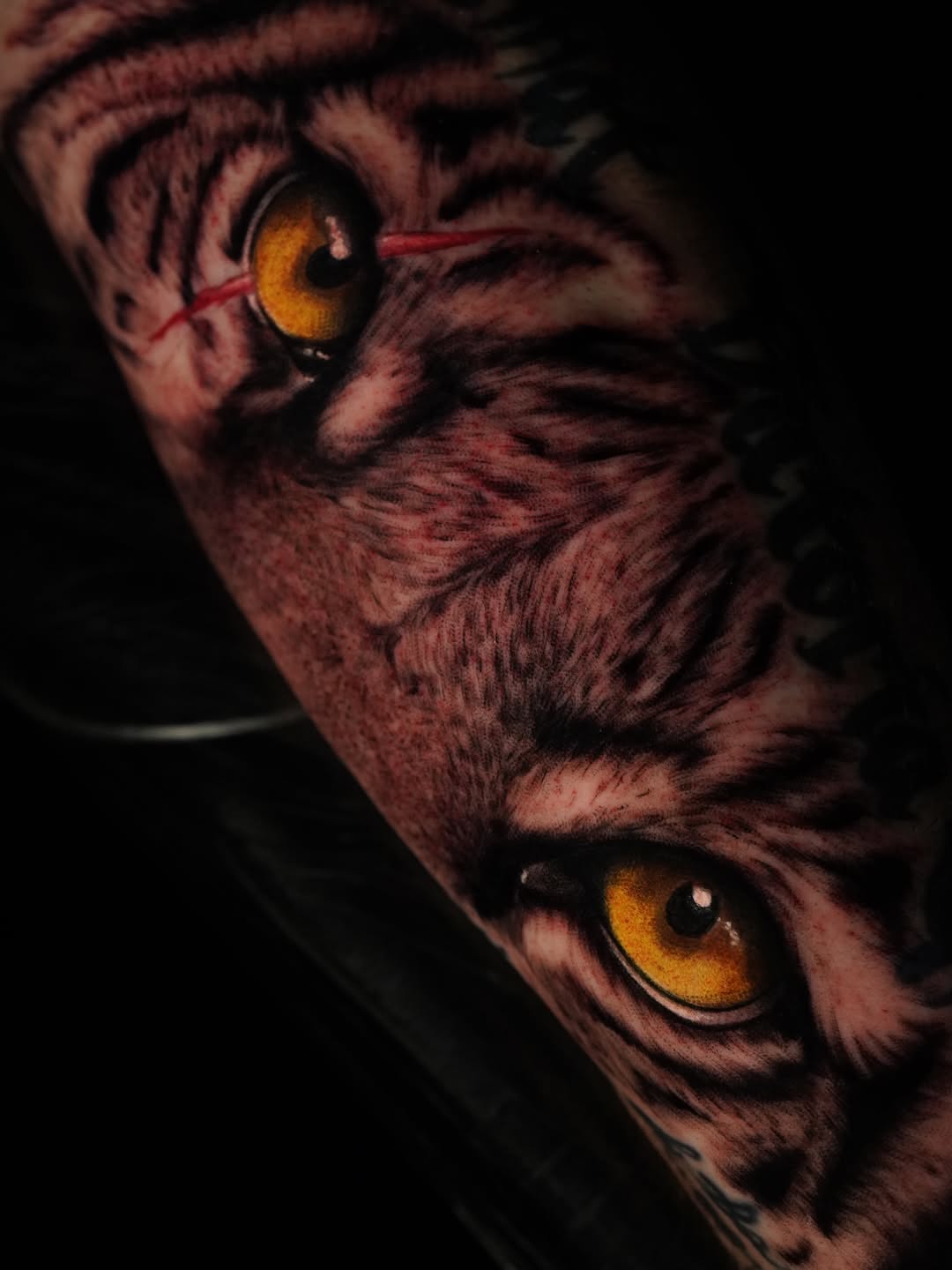 Tiger face realism tattoo on the forearm by Jennifer Garcia