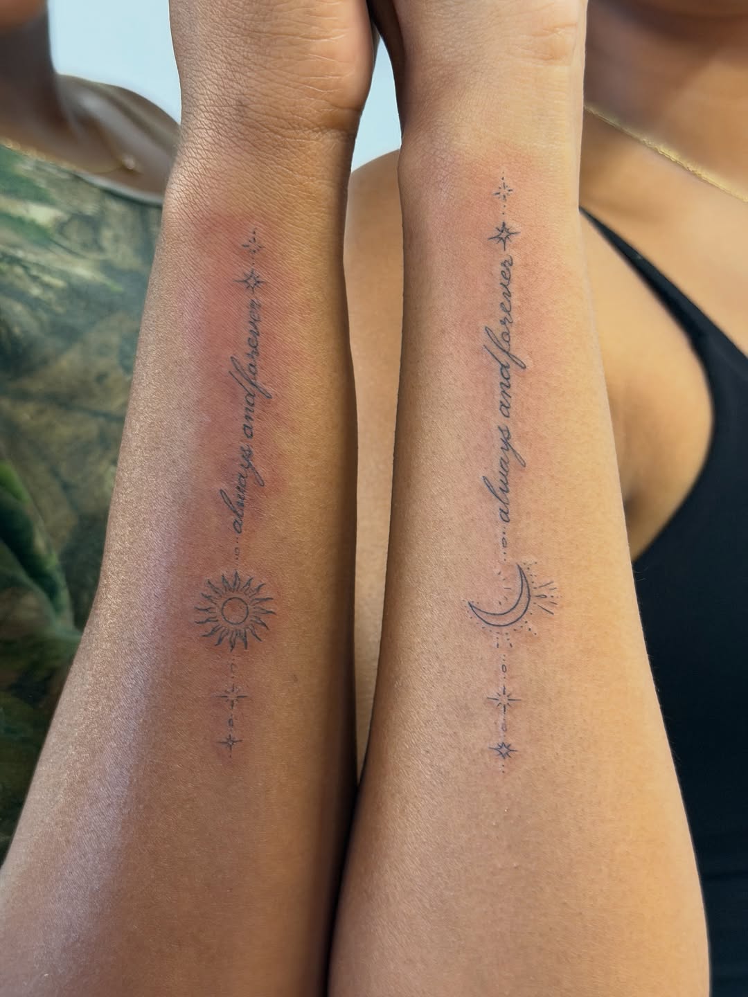 Sun, moon, stars and script lettering tattoo on the forearm by Sienna (jj) Hicks