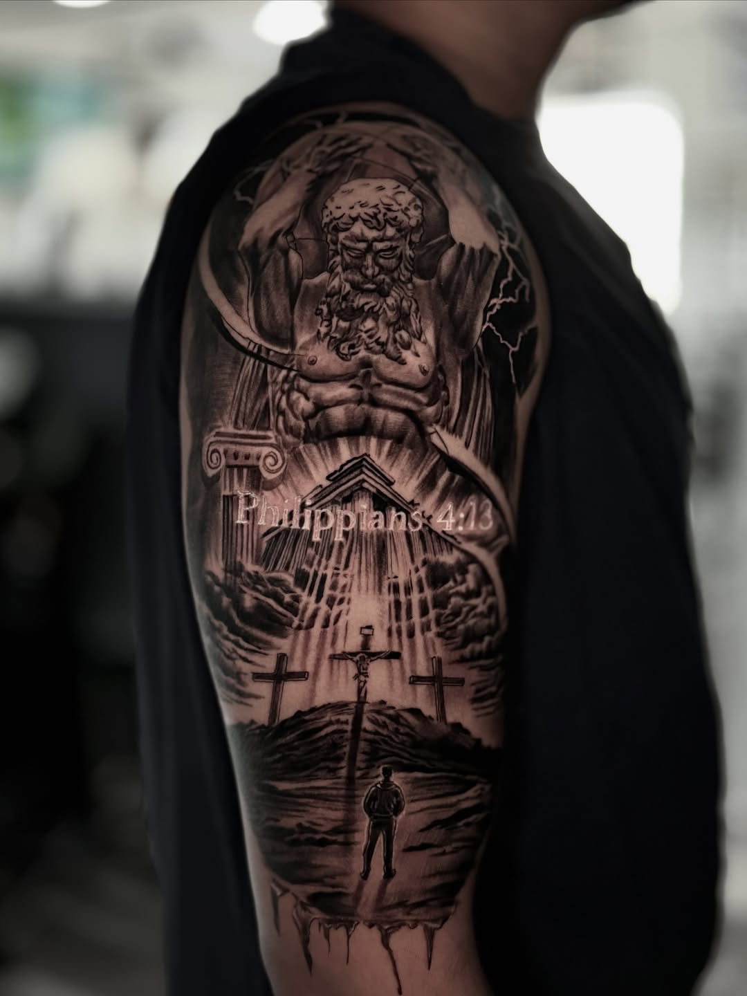 Realism tattoo on the upper arm by Miguel Garcia