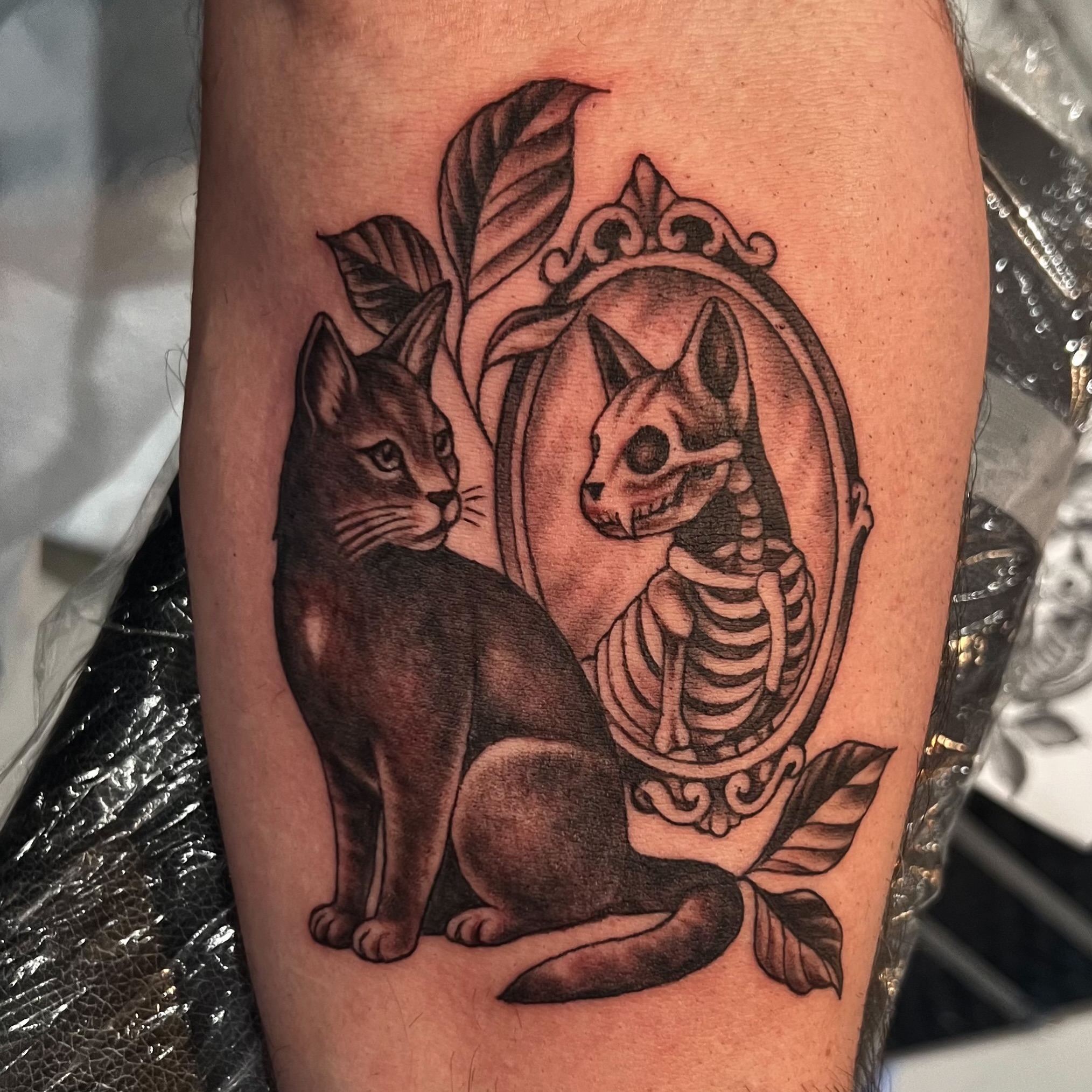 Cat skeleton realism tattoo on the thigh by Nikki Malfitano