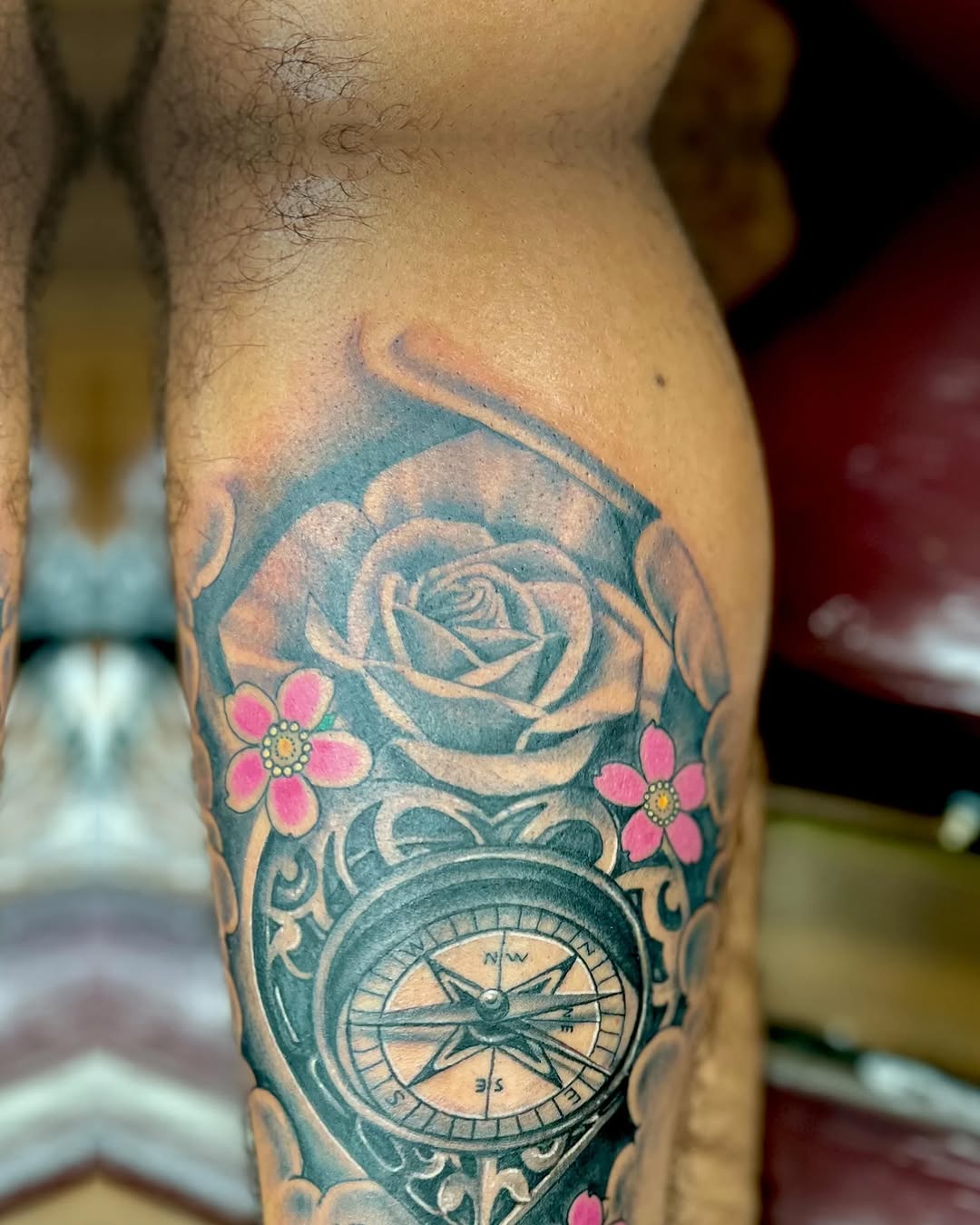 Rose and compass tribal tattoo on the forearm by Watson Gutkowski