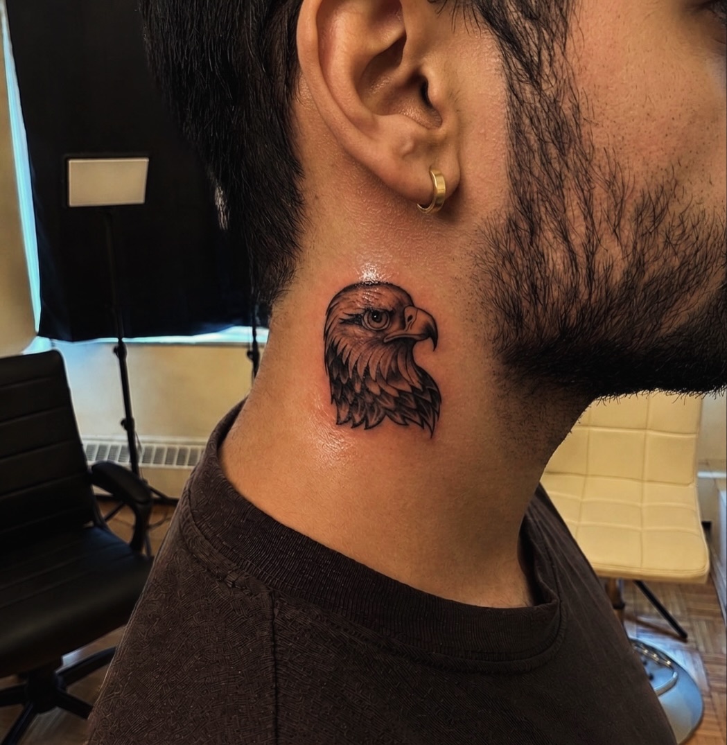 Eagle head fine line tattoo on the neck by I N K S L A y e R