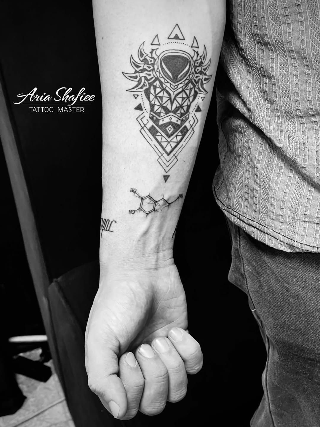 Tribal tattoo on the forearm by Aria Shafiee
