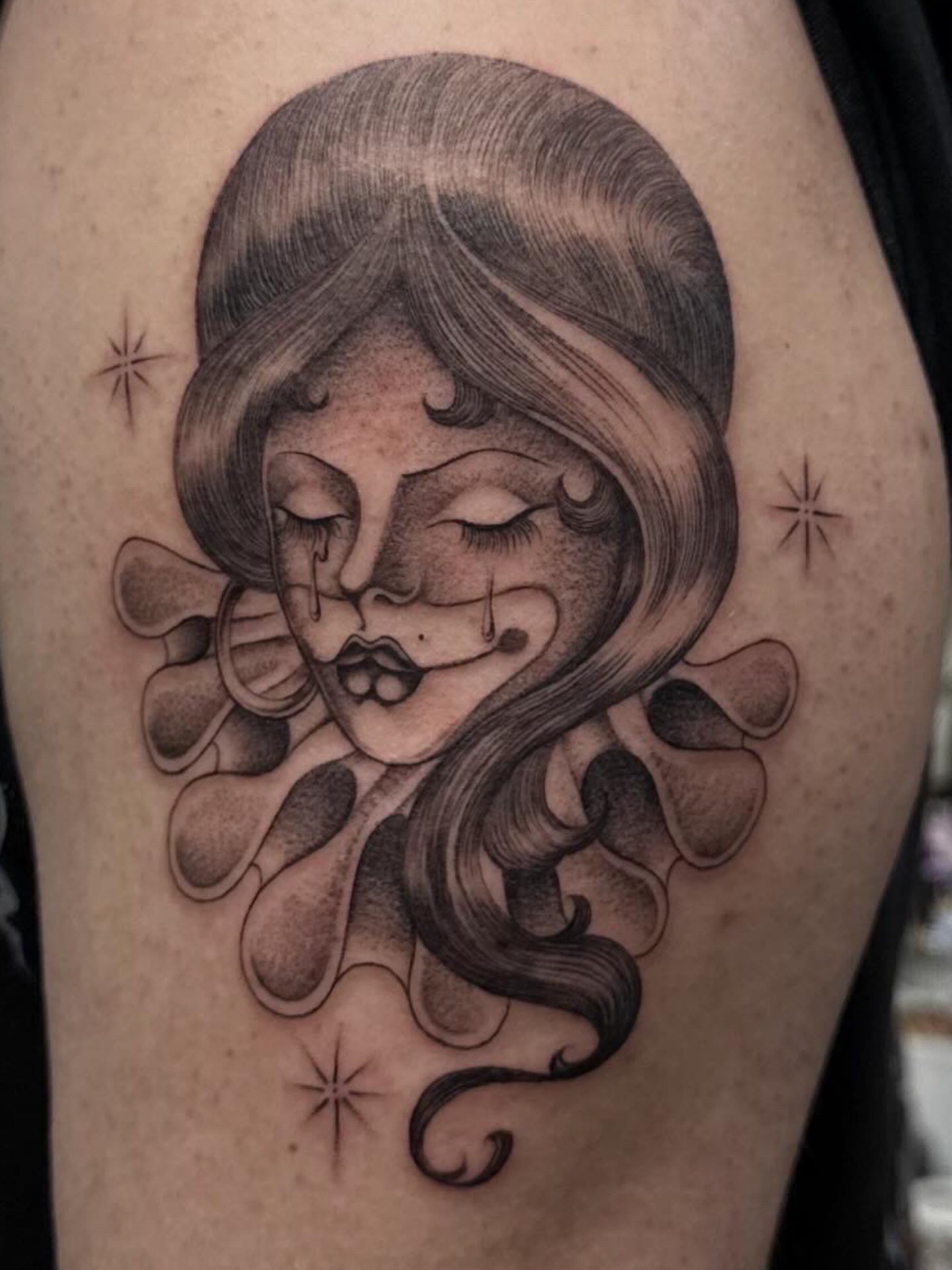 Woman with closed eyes realism tattoo on the thigh by H e I D I
