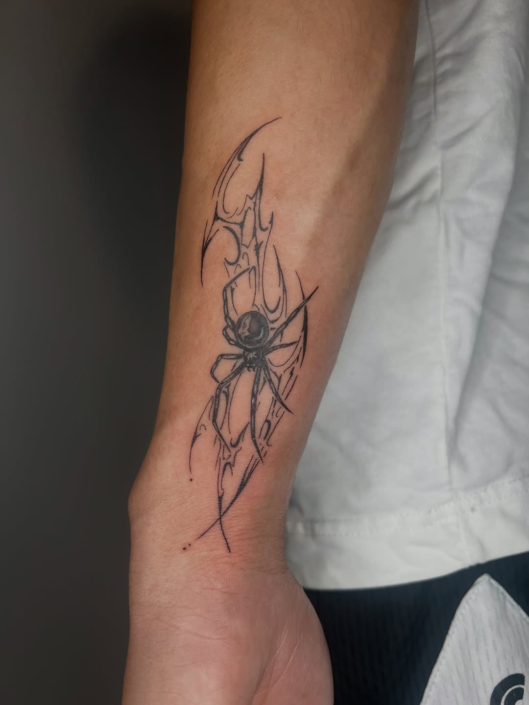 Spider with abstract elements blackwork tattoo on the forearm by ๐ฆ๐๐๐ก ๐ฆ๐๐๐