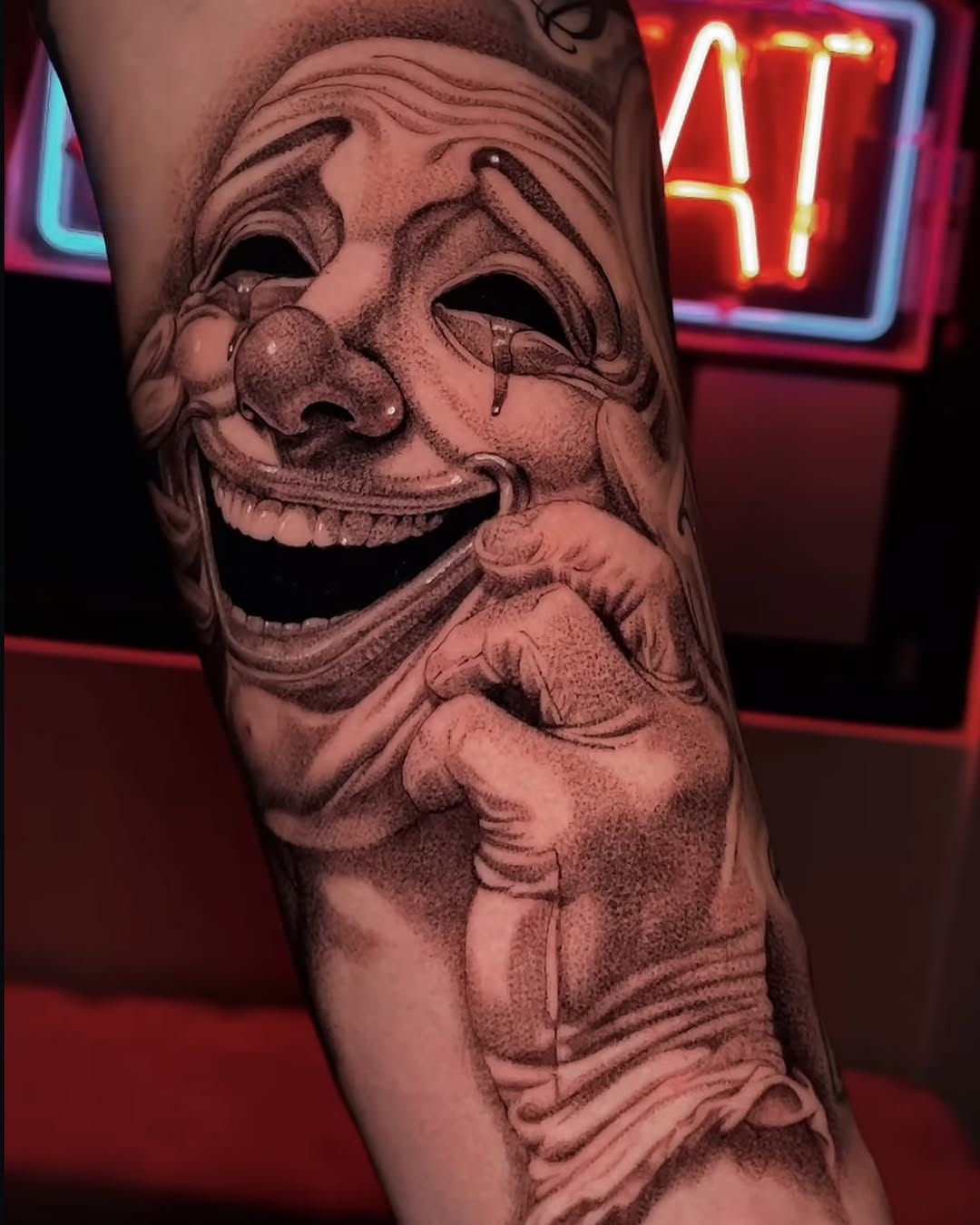 Crying clown mask realism tattoo on the forearm by Chato