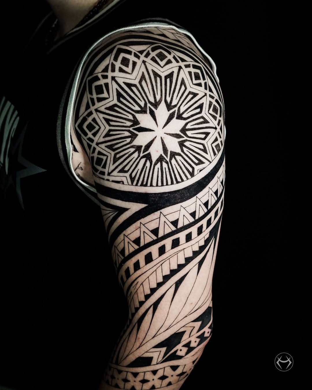 Geometric tribal sleeve geometric tattoo on the upper arm by Mali Sarsılmaz, Nicosia, Cyprus