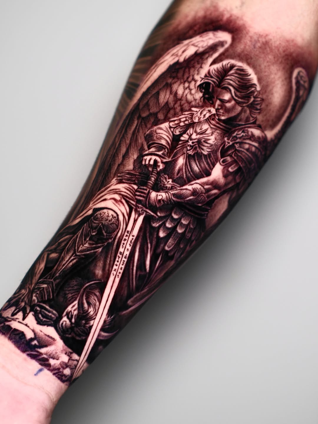 Archangel Michael with sword realism tattoo on the forearm by Dallas tattoo artist