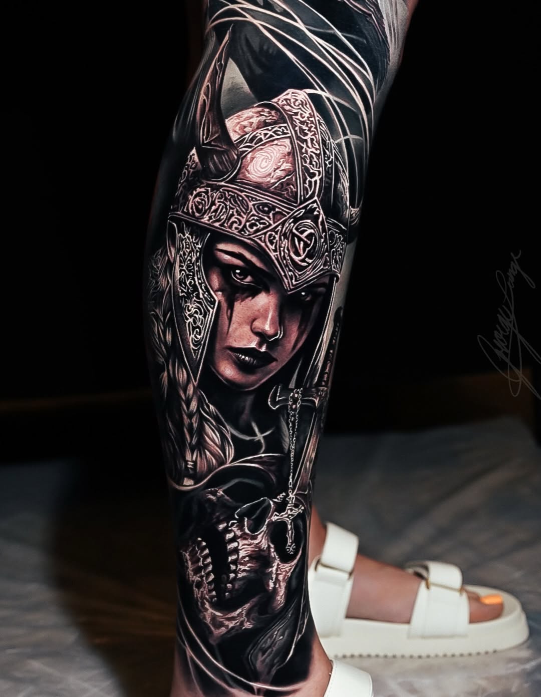 Viking woman and skull realism tattoo on the forearm by George Lange