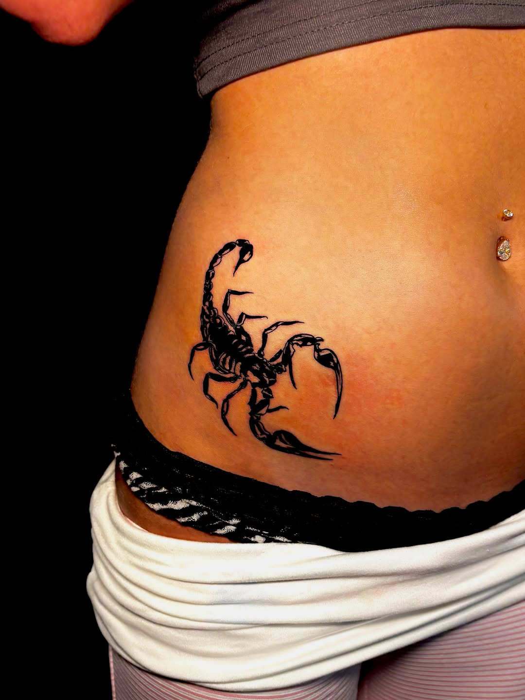Scorpion fine line tattoo on the torso by JT.tattoos