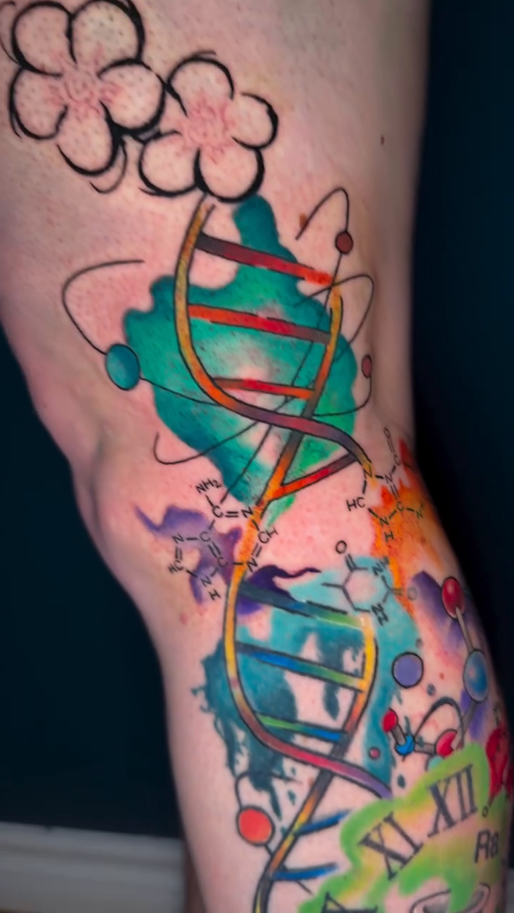 DNA and molecular structures watercolor tattoo on the leg by Erin Peterson